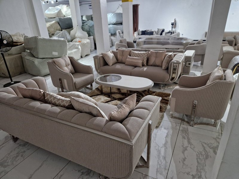 Luxury Champagne Beige Textured Fabric Sofa Suite with Silver Chrome Accent Framing - Image 1