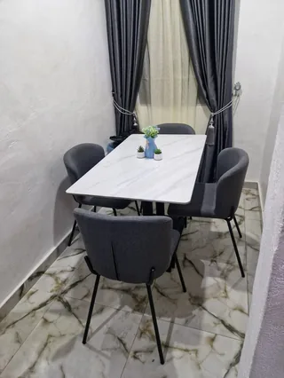 Modern White Faux Marble Dining Set with 4 Charcoal Grey Chairs